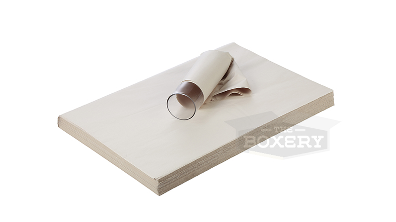 Newsprint packing sheets used as void fill inside shipping boxes.